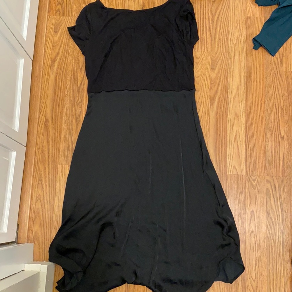 Cute black dress. Silk bottom. Cotton top. Never worn